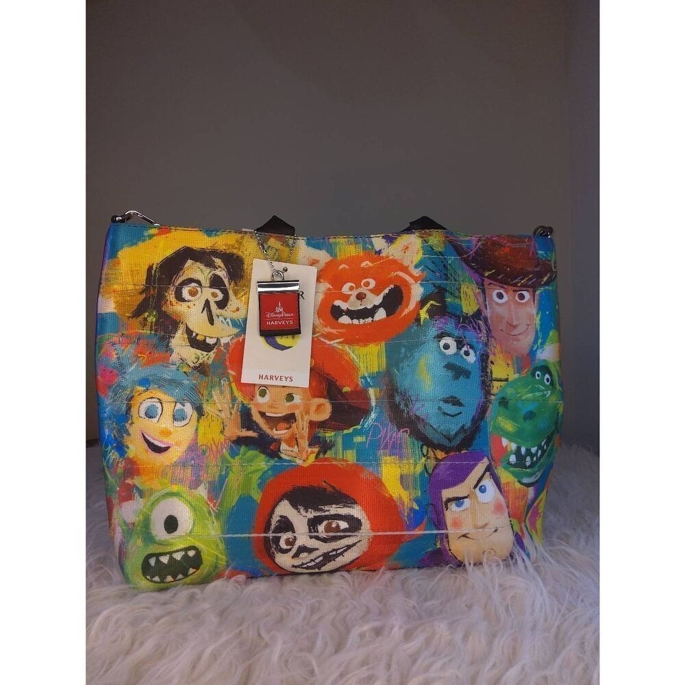Harveys Disney Parks Pixar Seatbelt Tote Bag Purple Multi Toy Story Monsters Inc